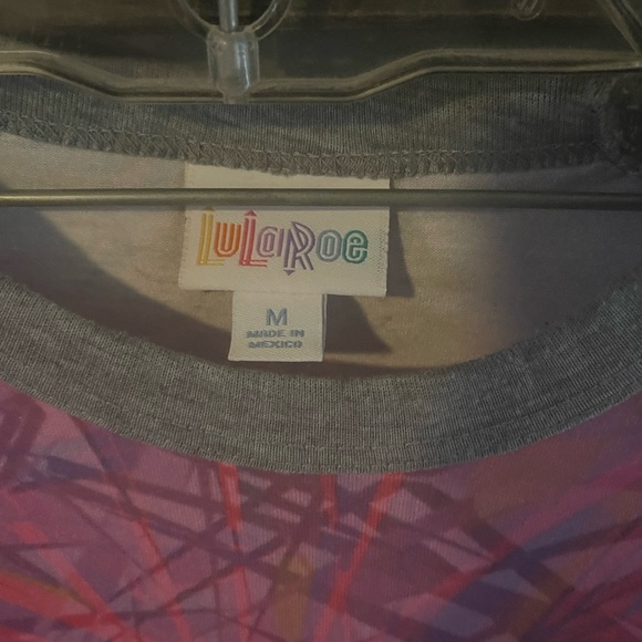 2- Lularoe Randy shirts. Disney print NWT and pink gently used. - Picture 5 of 6